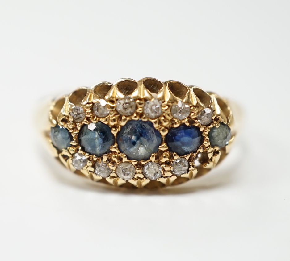 A George V 18ct gold, sapphire and diamond cluster set navette shaped ring, size N, gross weight 2.7 grams.